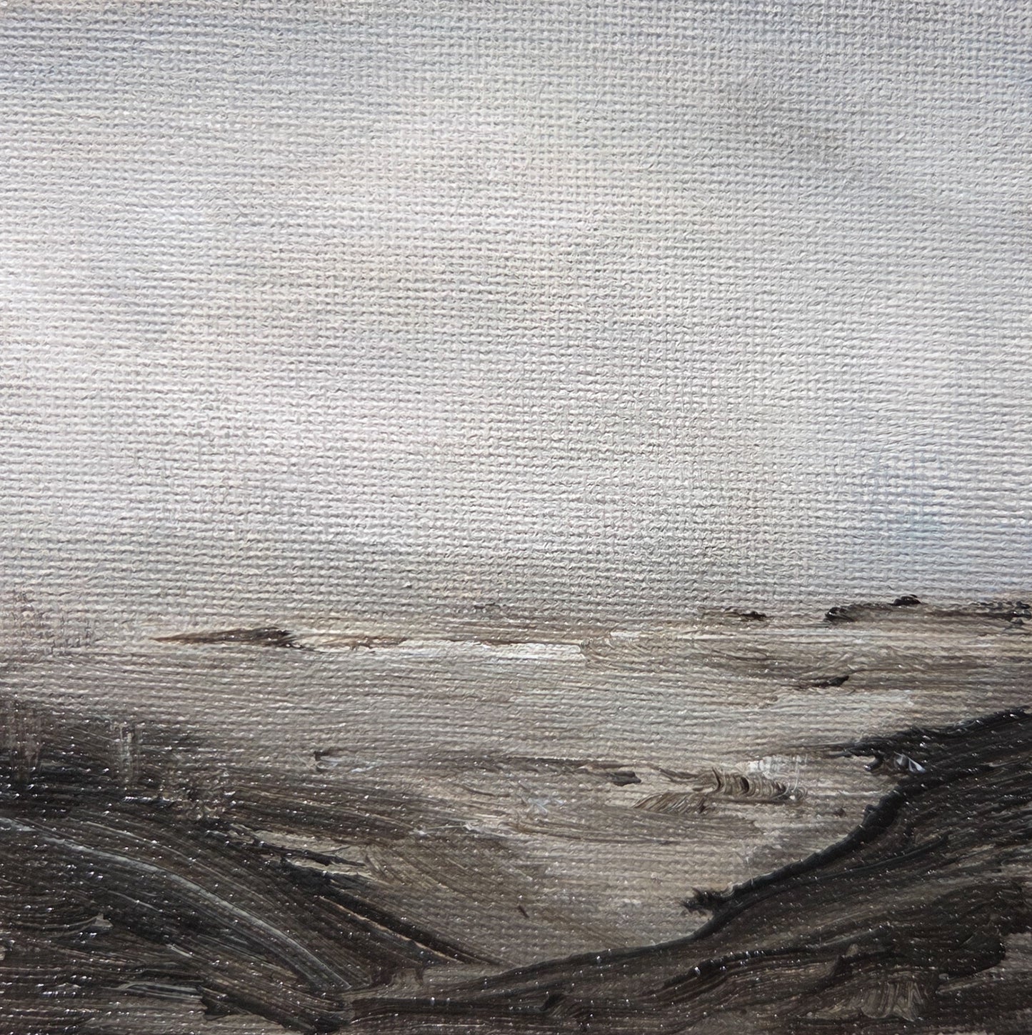 Small, textured abstract landscape painting in neutral tones, featuring a large light sky and dark, low terrain.