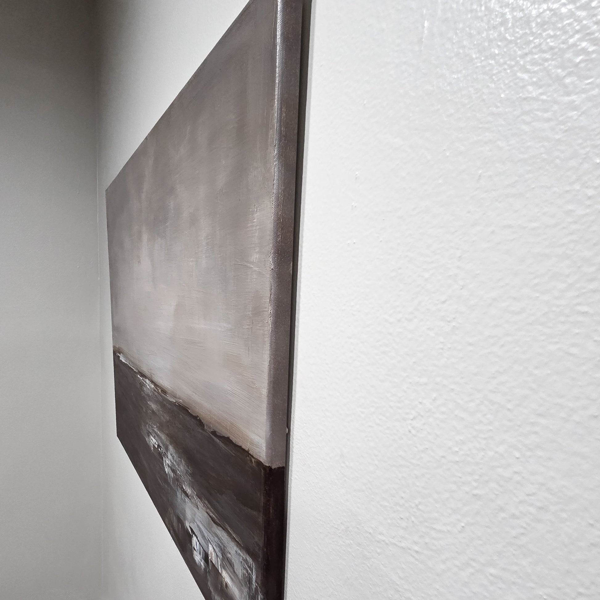 Abstract painting on a textured wall showing the painted edges.