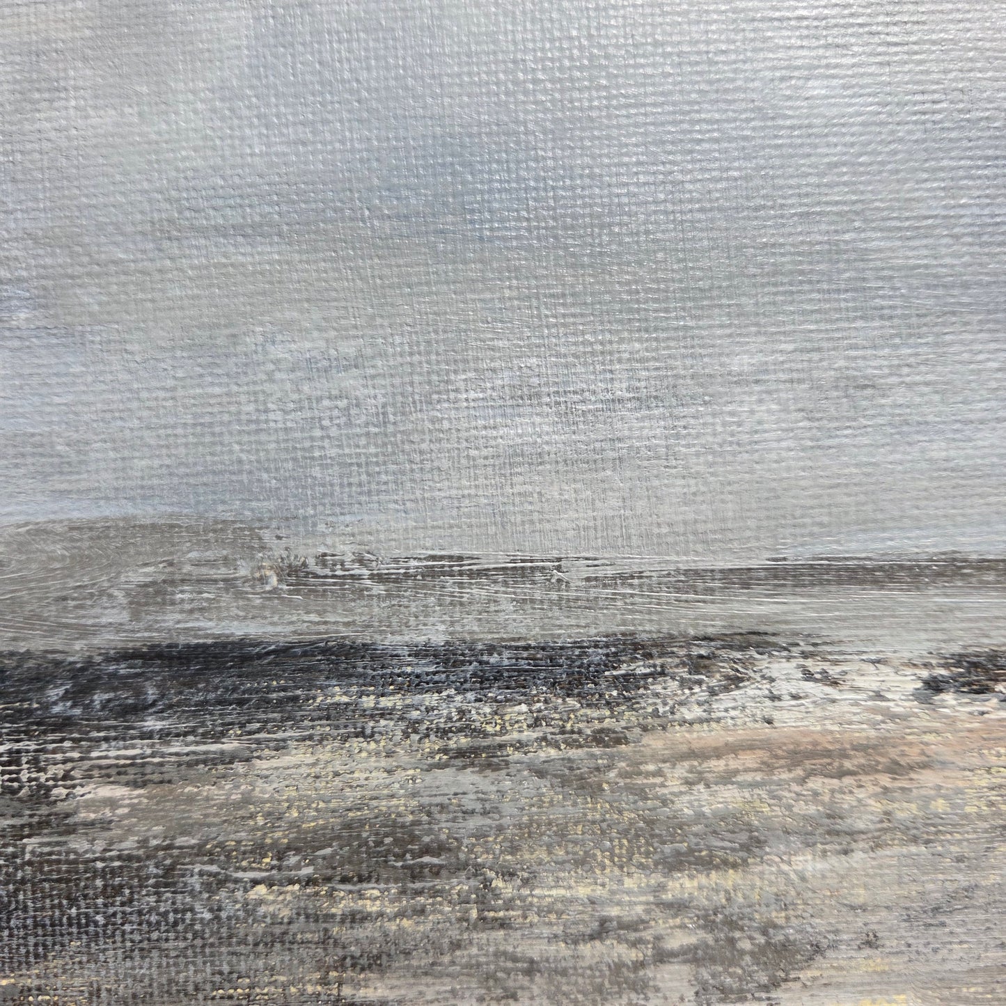 Textured surface with a mix of gray, brown, and black colors