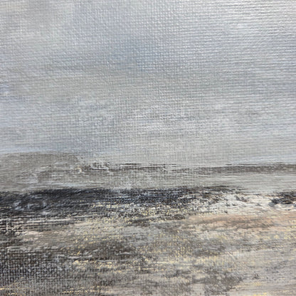 Textured surface with a mix of gray, brown, and black colors